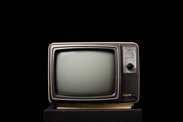 istock Retro old TV on wooden box on black background 1368198930