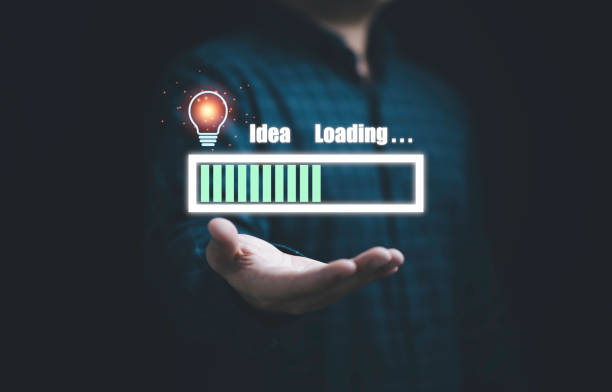 istock Businessman holding virtual download icon with lightbulb for show status progress of creative thinking idea and problem solving concept. 1368199210