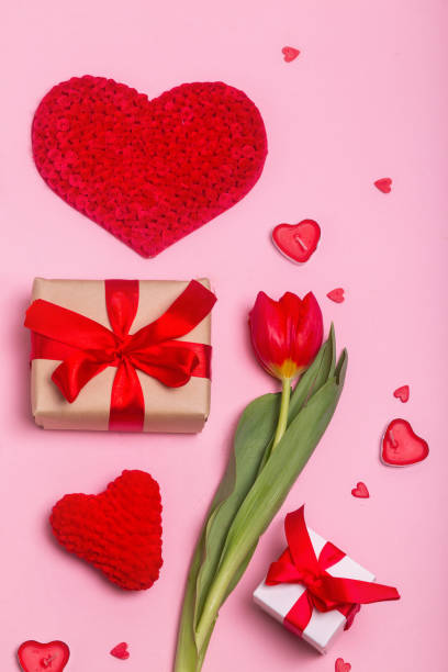 istock alentine's Day concept with gift boxes, flower and hearts on pink background. Flat lay. 1368199522