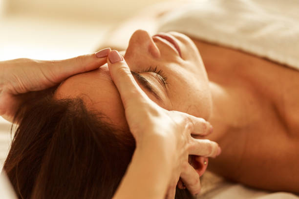 istock Woman receiving a relaxing face massage at a spa 1368201306