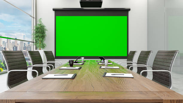 istock Mock Up Projection Screen with Green Chroma Key at the Office Boardroom 1368203793