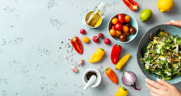 istock Fresh raw ingredients for colorful spring vegetable salad with cherry tomatoes and peppers 1368204275