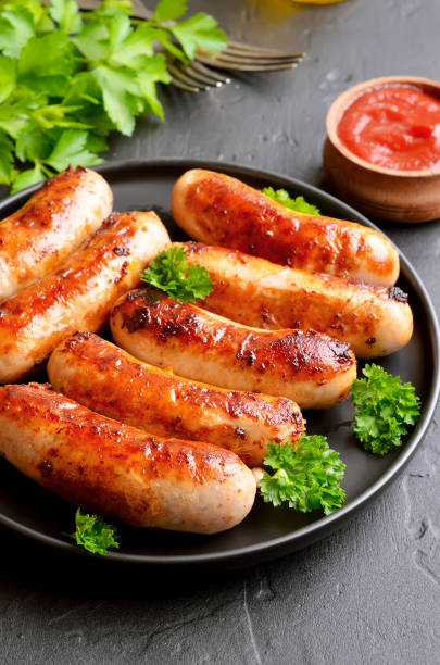 istock Roasted sausages on cutting board 1368204398