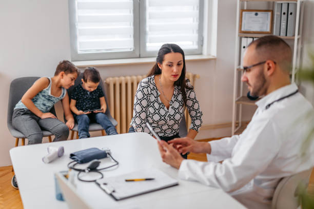 istock Mother Consulting With A Pediatrician 1368204584