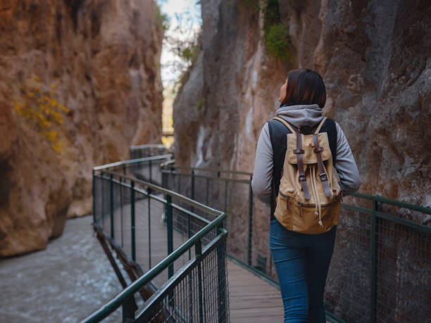 istock Happy asian woman is enjoy active hiking 1368205984