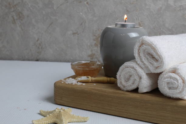 istock spa massage relax. Towels scrub salt candles with space for text copyspace 1368208381