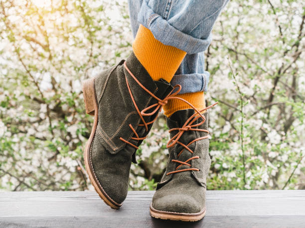 istock Trendy boots and colorful socks. Day light 1368209208