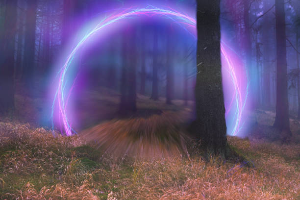 Neon portal in the foggy forest, magical evening stock photo