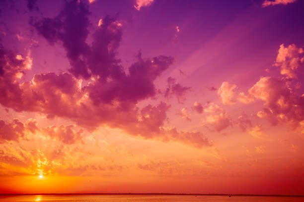 istock Colorful cloudy sky over the sea at sunset 1368209928