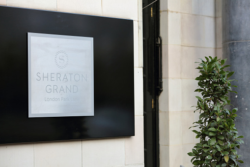 London, UK - January 19, 2022: Sheraton logo on their main hotel in London. Sheraton is a worldwide brand, owner and franchise of luxury hotels.