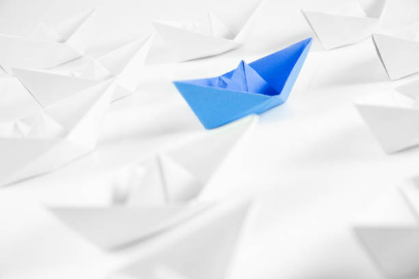 istock Blue Paper Boat 1368212826