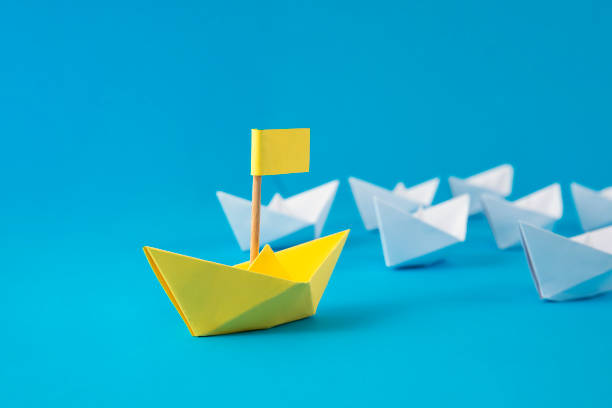 istock Leadership Concept with Paper Boats 1368212890