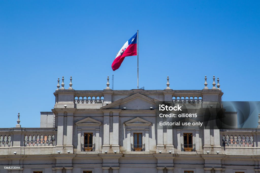 La Moneda Palace in Santiago de Chile Santiago de Chile, Chile - November 26, 2015: Chilean national flag on top of Palacio de la Moneda, te seat of the president. Chile Stock Photo