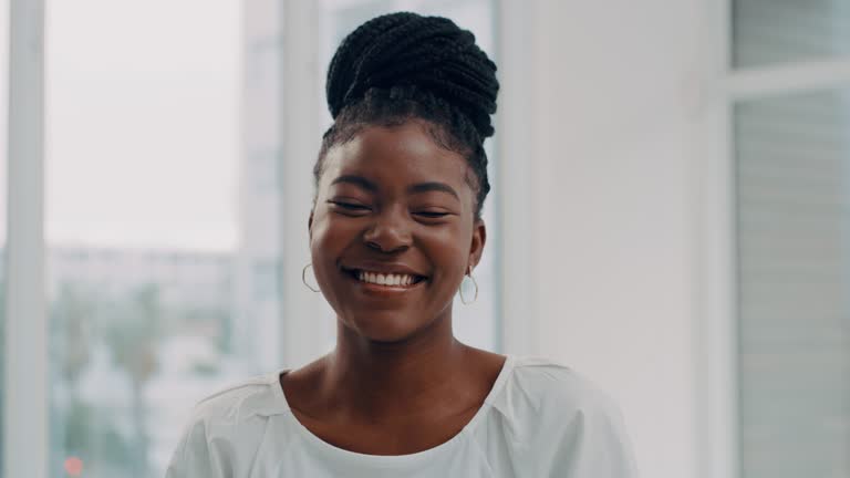 4k video footage of  an attractive young businesswoman alone in her office during the day