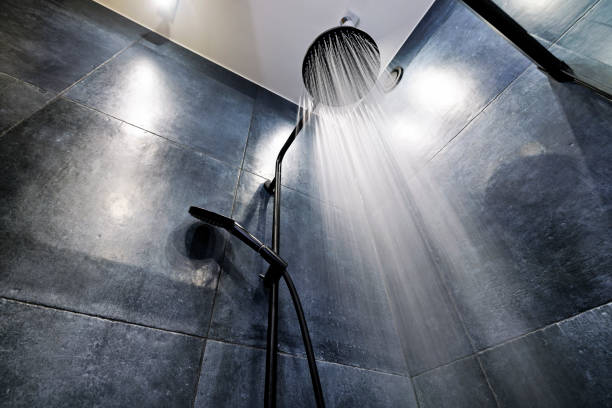 istock Water running from a black rain shower head 1368214448