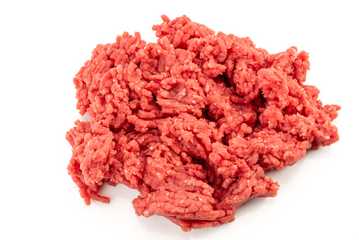 Beef mince meat isolated on white, raw minced meat in close-up in top view