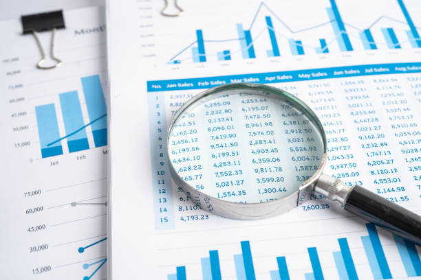 istock Magnifying glass on charts graphs paper. Financial development, Banking Account, Statistics, Investment Analytic research data economy, Stock exchange trading, Business office company meeting concept. 1368215988