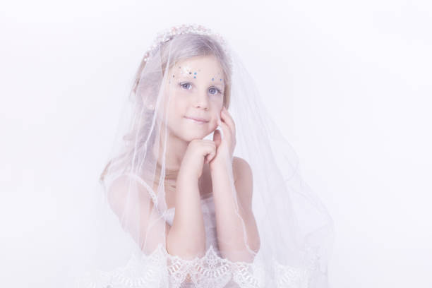 Beautiful mother and daughter in a bright key.Idea and the concept of winter and blizzards, beautiful fairy-tale images
