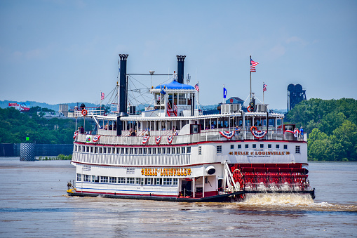 The sternwheeler Belle of Louisville underway on the Ohio River. The Belle is a popular tourist attraction, making daily sightseeing cruises on the Ohio River.