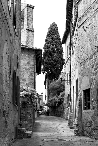 Monticchiello, Italy - 15 May 2021 - The wonderful medieval and artistic village of Tuscany region, in the municipal of Pienza, Val d'Orcia UNESCO site, during the spring. Here in particular with a suggestive alley