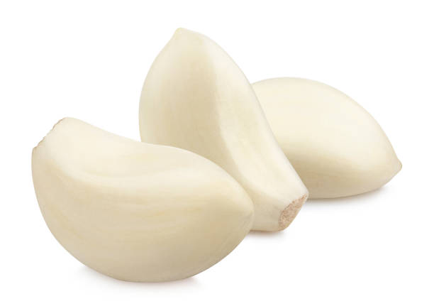 istock Purified garlic cloves on white 1368220252
