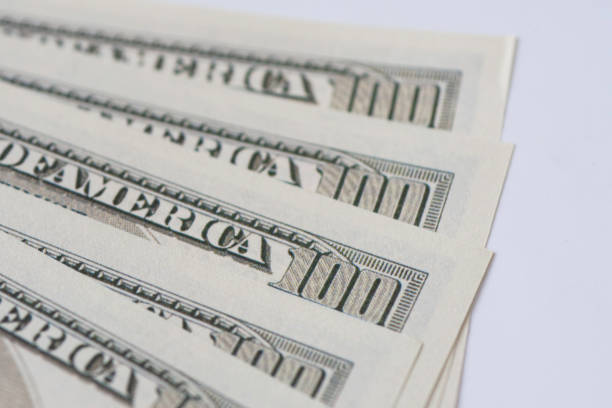 istock US dollar banknotes, close up one hundred dollar banknotes. 1368223623