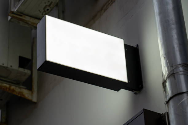 istock Blank gray round store signboard Mockup. Empty circular illuminated shop lightbox template mounted on wall. Mock up of illuminated blank signboard. Place for text, outdoor advertising, banner 1368225418