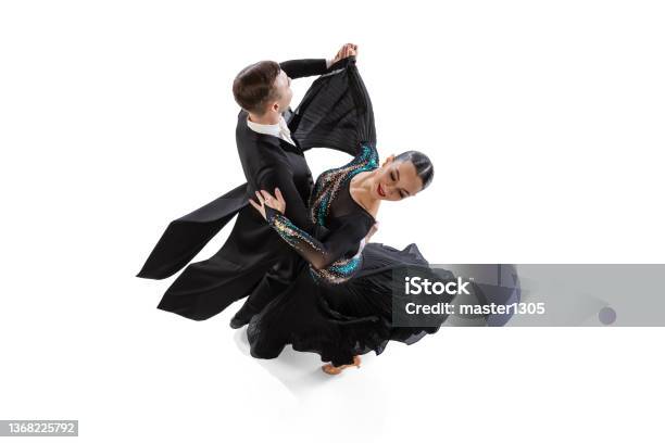 Top View Portrait Of Young Artistic Couple Dancing Waltz Isolated Over White Studio Background Stock Photo - Download Image Now