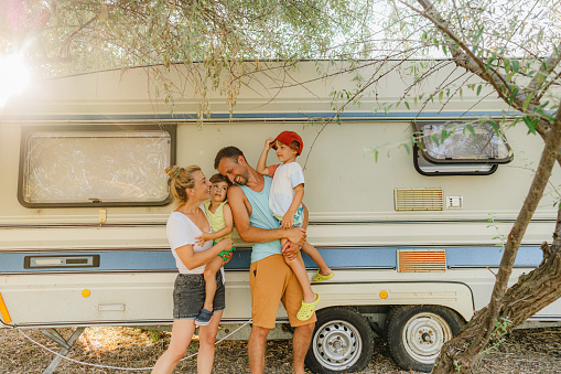 Photo of a happy family having precious moments together during their RV vacation