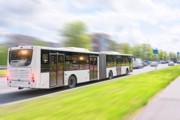 istock Bendy bus driving in city traffic in motion blur. 1368227410