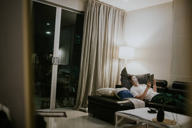 istock Resting time while masking face and watching movie on digital tablet 1368229052