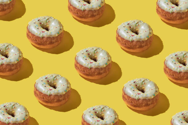 istock Doughnut repetition food background. 1368229141