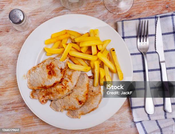Fried Barbecue Pork Meat With Baked Potato Stock Photo - Download Image Now - Barbecue - Meal, Chopped Food, Close-up