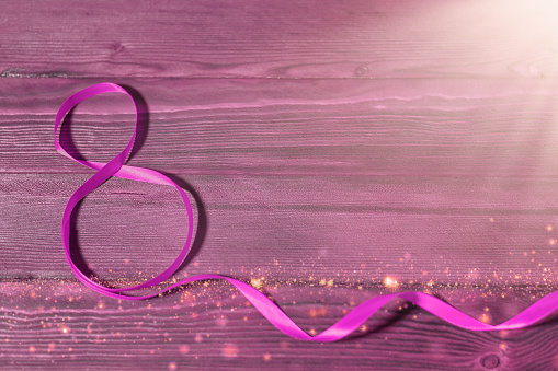 Greeting card template for March 8. Ribbon in the form of 8. International Women's Day poster. in purple lilac color. mock up