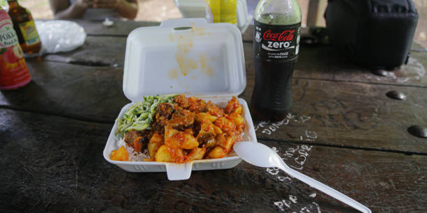 Traditional cari poulet from Reunion Island Traditional cari poulet and bottle of Coca-Cola Zero in Reunion Island coke zero photos stock pictures, royalty-free photos & images