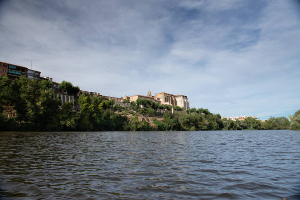 From the Duero river, on a summer afternoon, you can see the banks of the Royal Monastery of Santa Clara in Tordesillas.