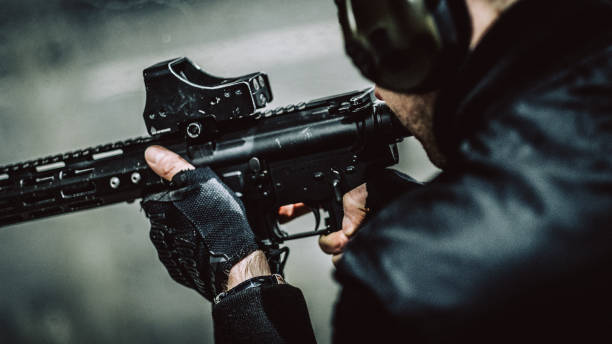 istock Soldier training on a shooting range. M4 AR-15 rifle 1368234084