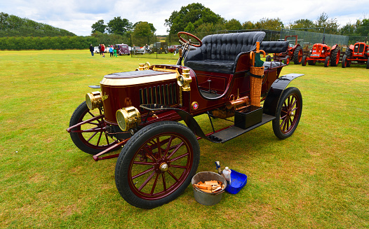 Upper Dean, Bedfordshire, England - September 07, 2019: Vintage Stanley Steam Car Isolated Parked on Grass.