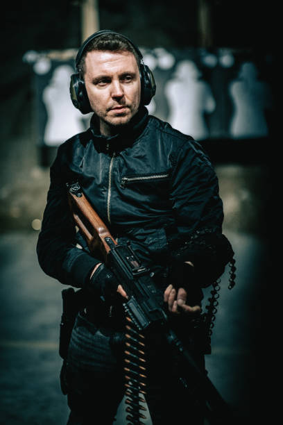 istock Sniper's training on a shooting range. Holding heavy PKM machine gun 1368237386