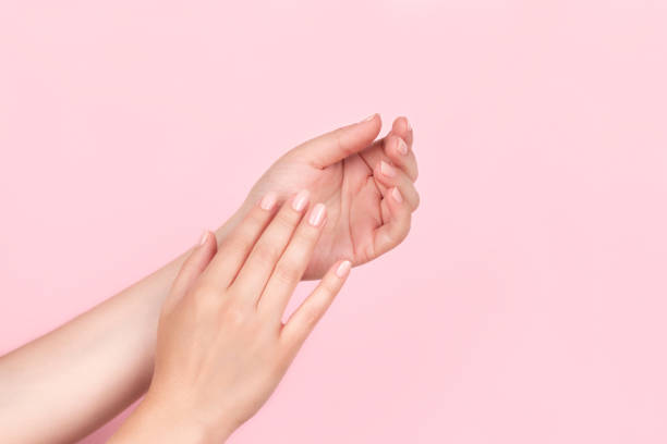 istock Female hands with nude nails 1368237476