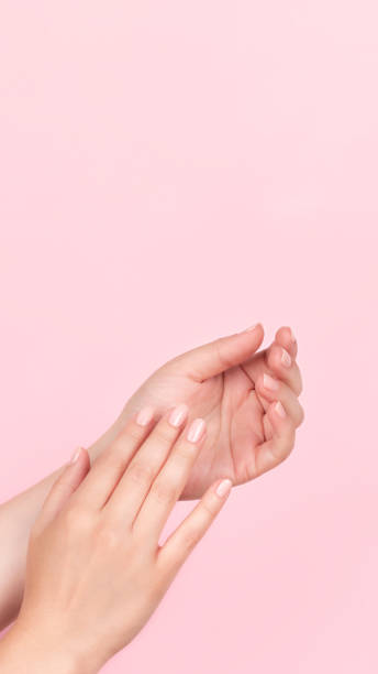 istock Female hands with nude nails 1368237483