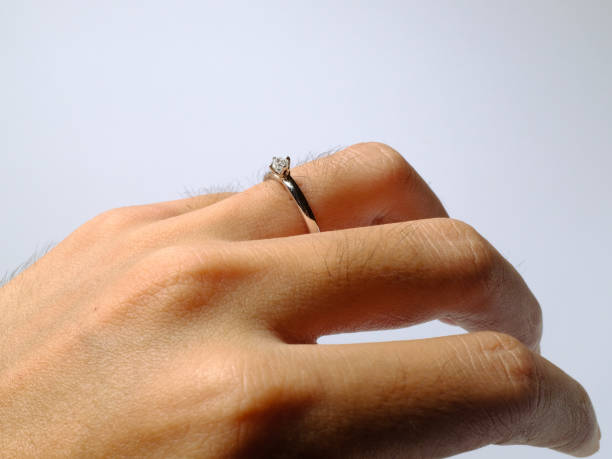 istock Show ring on finger isolated on white background 1368237528