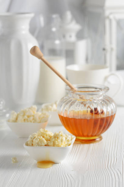 istock Fresh homemade cottage cheese with honey. 1368240982
