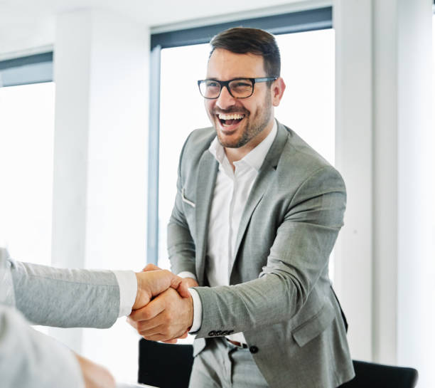 istock business man office work hand shaking meeting agreement offer handshake greeting introducing office 1368241072