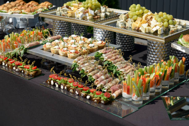 istock Italian appetizer soft cheese wrapped in parma ham and other food served on a table 1368241468