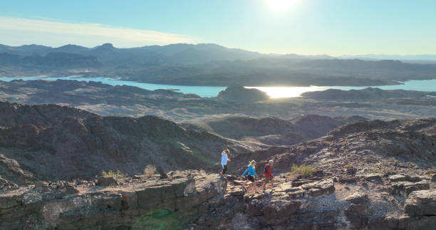 istock Aerial view, hikers follow route along desert ridge crest 1368243078