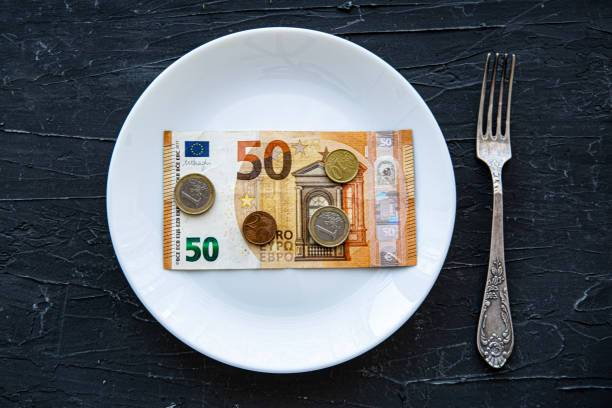 istock Money spend on food concept on black backgorund. 1368246964