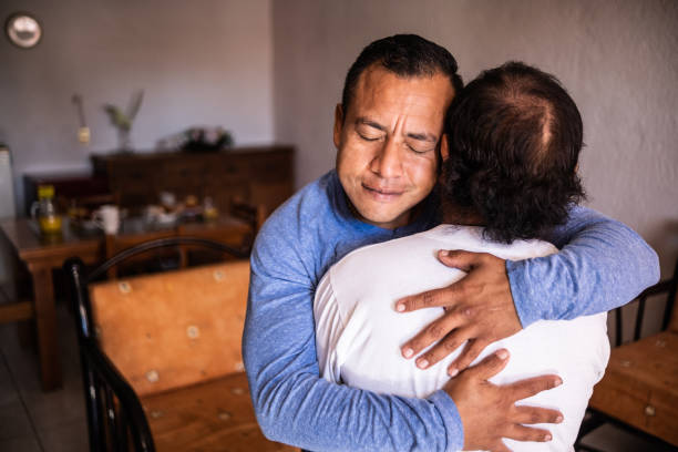 istock Latin father and son hugging each other at home 1368249843