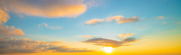 istock Clouds and yellow sky,The sun shining through low cloud,sunrise with clouds, light rays and other atmospheric effect 1368249943