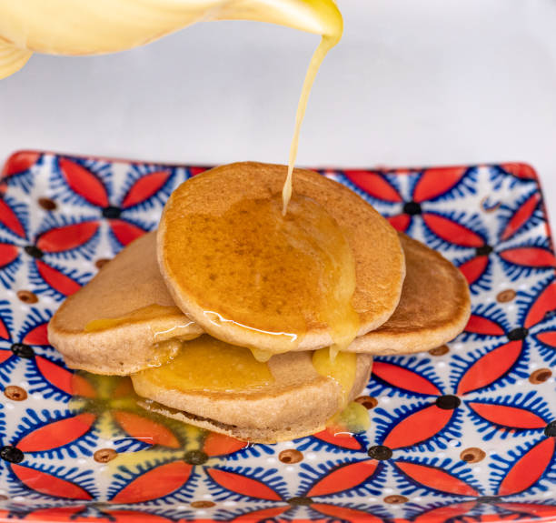 istock Mini pancakes with melted butter being poured on to them 1368250160